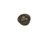 une image représentant une pièce d'argent sur laquelle figurent un cheval et un cavalier