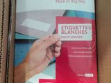 a box of paper that has a hand holding it