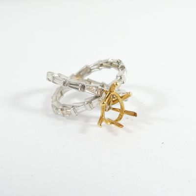 silver and gold plated ring with anchor and anchor on it