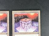 two cards that are sitting on a table