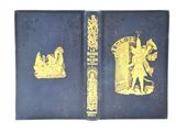 un vieux livre bleu orné d'illustrations dorées représentant un homme et une femme