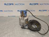 a pump with a hose attached to it sitting on a table