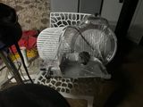 a plastic chair that has been wrapped in plastic and is next to a metal chair