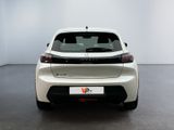the rear end of a white car in a white room