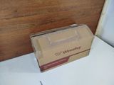 a cardboard box sitting on top of a white table