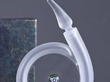 a glass sculpture of a swan with a diamond in its mouth