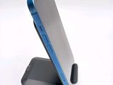 a cell phone that is sitting on top of a stand