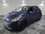 the small blue car is parked in the garage on a checkered floor