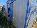 a blue and white building that is on the side of the road