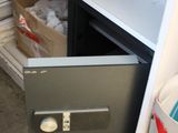 a drawer that has some plates and bowls in it