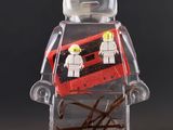 a lego man that is holding a red and black suitcase
