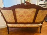 a couch that is sitting on a hard wood floor