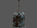 an image of a glass bell hanging from a chain