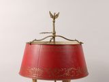 an image of a lamp with a red shade on it