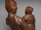 statue of a woman holding a child on her lap