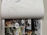 a picture of a comic book open on the wall