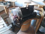 a laptop computer sitting on top of a wooden barrel