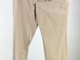 men ' s khaki pants on a hanger against a white background