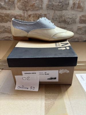 a box that has a pair of shoes on top of it