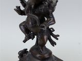 a bronze statue of the hindu god ganesh