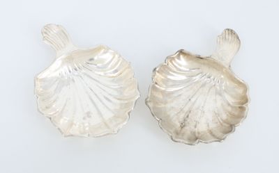 pair of silver shell shaped salt and pepper shakers