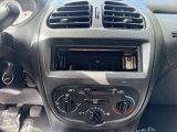 the dashboard of a car with a clock and radio in it