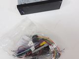 a box of wires and a remote control on a table