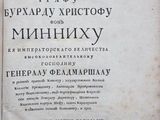 an old book that is open on a table