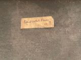 a piece of wood with a label on it