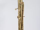 an old brass musical instrument hanging from the ceiling