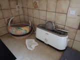 a toaster and a basket on the counter in the kitchen