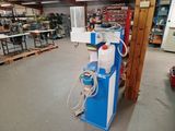 a blue and white machine that is in a room
