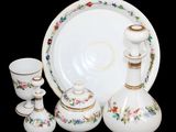 a picture of a set of porcelain objects including a vase, plate, and cups