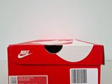a red box with a barcode on it sitting on a table