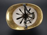 a gold plate with a black and white design on it