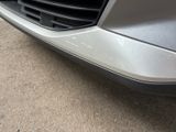 a close up of a car ' s front bumper