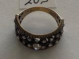 a close up of a ring on a table with a price tag