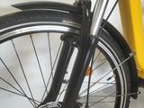 a close up of a bicycle with a yellow seat
