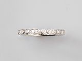 a close up of a diamond ring on a white background