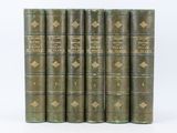 un ensemble de six livres anciens reliés en cuir, avec des bordures dorées