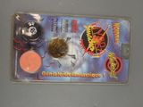 a picture of a card with a coin and a coin on it