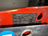a close up of a red truck with a sign on it