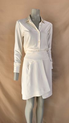 a mannequin wearing a white shirt and skirt