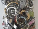a bag of assorted watches and other items in it