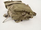 a backpack that is laying on the ground on the ground