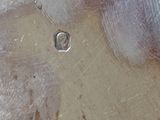 a close up of a piece of metal with a hole in it