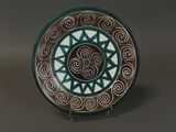 a picture of a decorative plate with a spiral design on it