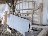 a pile of junk in a shed next to a building
