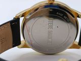 a close up of a watch on a black leather strap