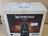 a box of nespresso coffee sitting on a table